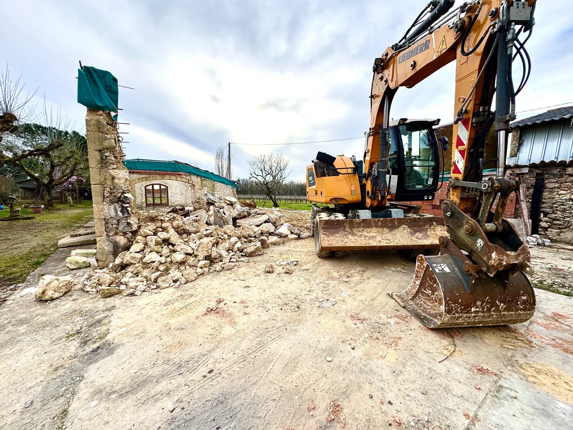 Excavator on a demolition site after a fire