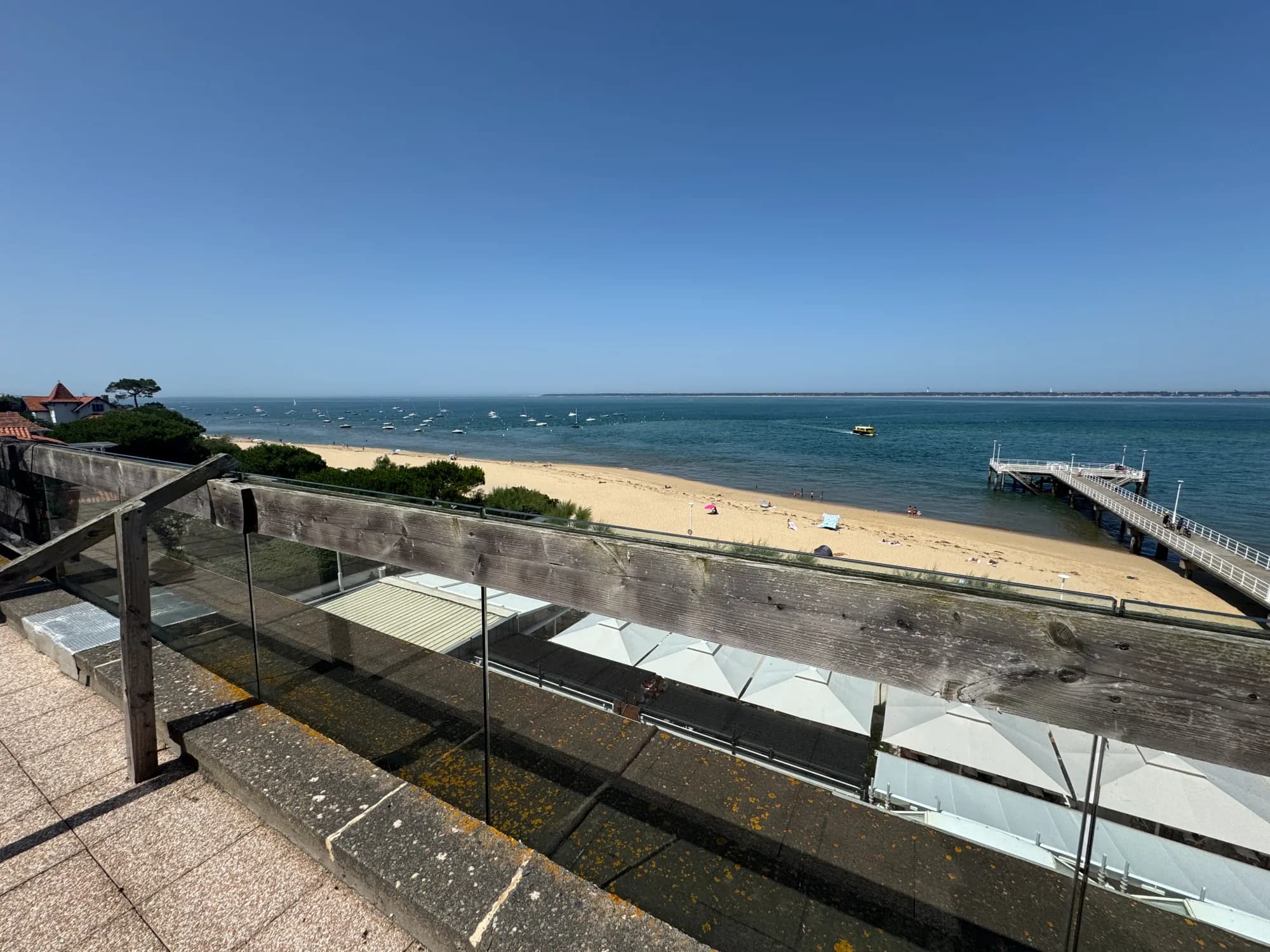 View over the beach and pier from a terrace on the Bassin d'Arcachon